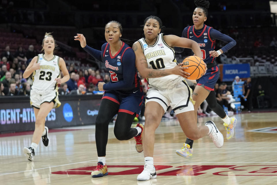 St. John's guard Mimi Reid (2) defends Purdue guard Jeanae Terry (10) in the second half of a First Four women's college basketball game in the NCAA Tournament Thursday, March 16, 2023, in Columbus, Ohio. (AP Photo/Paul Sancya)