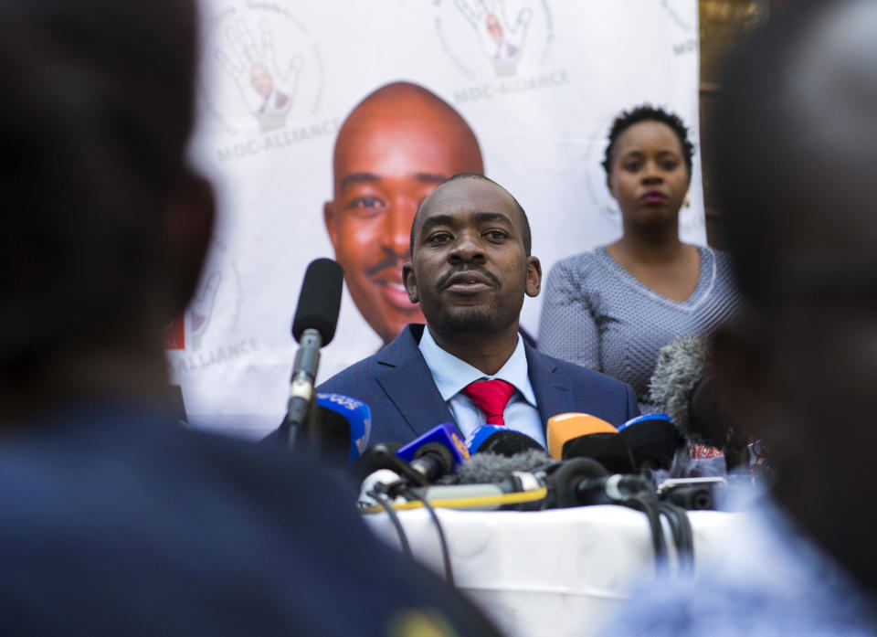 A press conference by opposition leader Nelson Chamisa gets underway in Harare, Zimbabwe, Friday Aug. 3, 2018. Hours after President Emmerson Mnangagwa was declared the winner of a tight election, riot police disrupted the press conference where opposition leader Nelson Chamisa was about to respond to the election results. (AP Photo/Jerome Delay)
