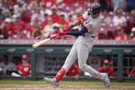 St. Louis Cardinals' Dylan Carlson hits a home run during the fourth inning of a baseball game against the Cincinnati Reds in Cincinnati, Sunday, July 25, 2021. (AP Photo/Bryan Woolston)