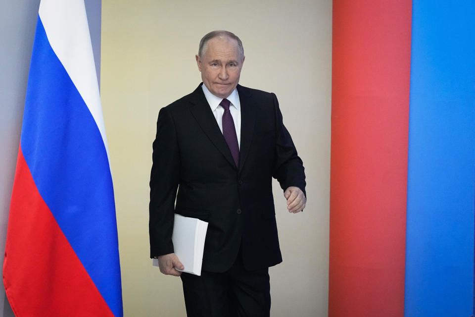 Russian President Vladimir Putin enters a hall to deliver his state-of-the-nation address in Moscow, Russia, Thursday, Feb. 29, 2024. (AP Photo/Alexander Zemlianichenko)