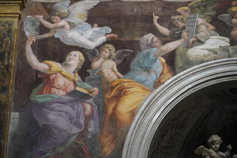 A detail of the 1514 fresco "Sybils receiving instruction from Angels" by Italian High Renaissance master painter Raffaello Sanzio, known as Raphael, adorns the inside of Santa Maria della Pace church, in Rome, Monday, Dec. 14, 2020. Like elsewhere in Europe, museums and art galleries in Italy were closed this fall to contain the spread of COVID-19, meaning art lovers must rely on virtual tours to catch a glimpse of the treasures held by famous institutions such as the Uffizi in Florence and the Vatican Museums in Rome. However, some exquisite gems of Italy's cultural heritage remain on display in real life inside the country's churches, some of which have collections of renaissance art and iconography that would be the envy of any museum. (AP Photo/Andrew Medichini)