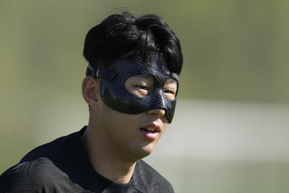 South Korea's Son Heung-min warms up during the South Korea's official training on the eve of the group H World Cup soccer match between Uruguay and South Korea at the Al Egla Training Site 5 in Doha, Qatar, Wednesday, Nov. 23, 2022. (AP Photo/Lee Jin-man)