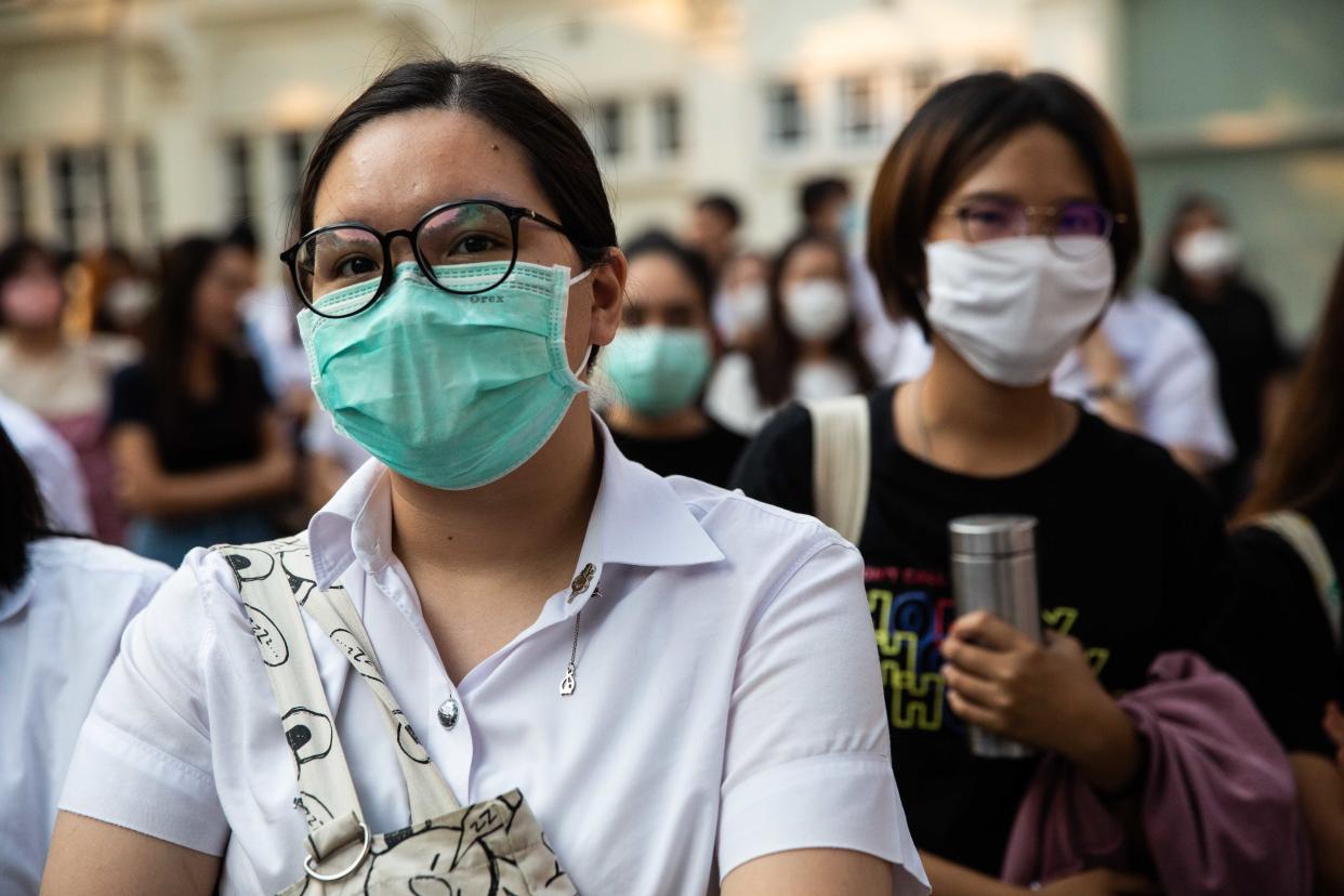 BANGKOK, THAILAND - FEBRUARY 24: Students in central Bangkok protest the dissolution of the Future Forward Party while wearing face masks to protect themselves against Covid-19 at Chulalongkorn University on February 24, 2020 in Bangkok, Thailand. Thailand's Constitutional Court last week ordered the dissolution of the popular Future Forward Party, after finding the party guilty of violating election law by accepting a loan from its founder. The Future Forward Party acted as the opposition to the Thai military and leaders of Parliament.Ê (Photo by Lauren DeCicca/Getty Images)