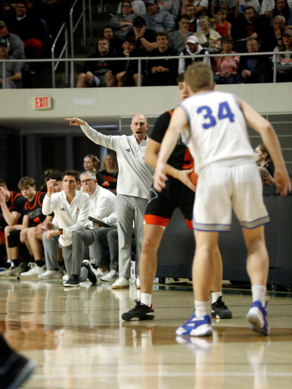 New Lex coach Jeremy Duerr calls out signals during a 54-46 overtime loss to VIncent Warren on Saturday in a Division II district final at the Ohio Convocation Center.