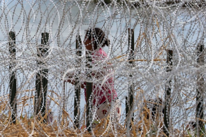 A migrant attempts to cross the Rio Grande River in Eagle Pass Texas on September 21. File Photo by Adam Davis/EPA-EFE