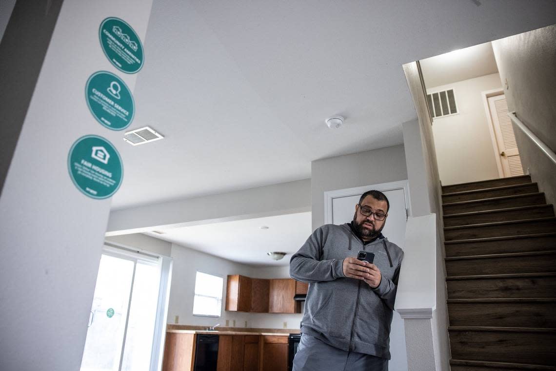 Jonathan Osman, a longtime Charlotte Realtor, looks up information about a home in northwest Charlotte that’s owned by Progress Residential. Signs on the walls tell prospective tenants how to apply, a phone number to call with questions and even a “make you feel at home” playlist for your tour.