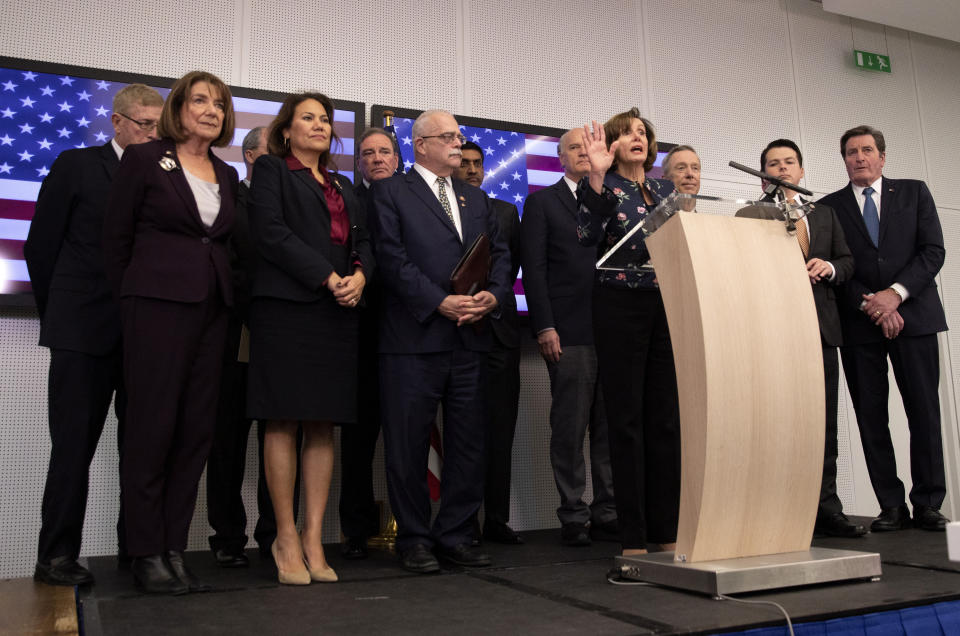 Speaker of the House Nancy Pelosi, D-Calif, center, speaks during a media conference after a meeting at NATO headquarters in Brussels, Monday, Feb. 17, 2020. Speaker of the House Nancy Pelosi is on a one day visit to Brussels to meet with leaders of the EU and NATO. (AP Photo/Virginia Mayo)