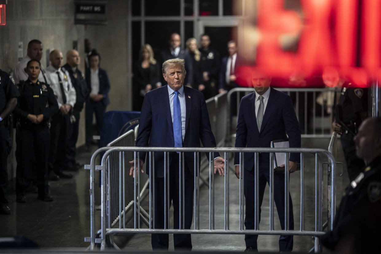 Former President Donald Trump is joined by his attorney, Todd Blanche, as he speaks to reporters outside the courtroom at the end of the first week of testimony in his criminal trial at Manhattan Criminal Court in Manhattan on Friday afternoon, April 26, 2024. (Dave Sanders/The New York Times)