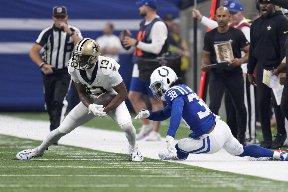 New Orleans Saints wide receiver Michael Thomas (13) sheds the tackle of Indianapolis Colts cornerback Tony Brown (38) during the first half of an NFL football game Sunday, Oct. 29, 2023 in Indianapolis. (AP Photo/Michael Conroy)