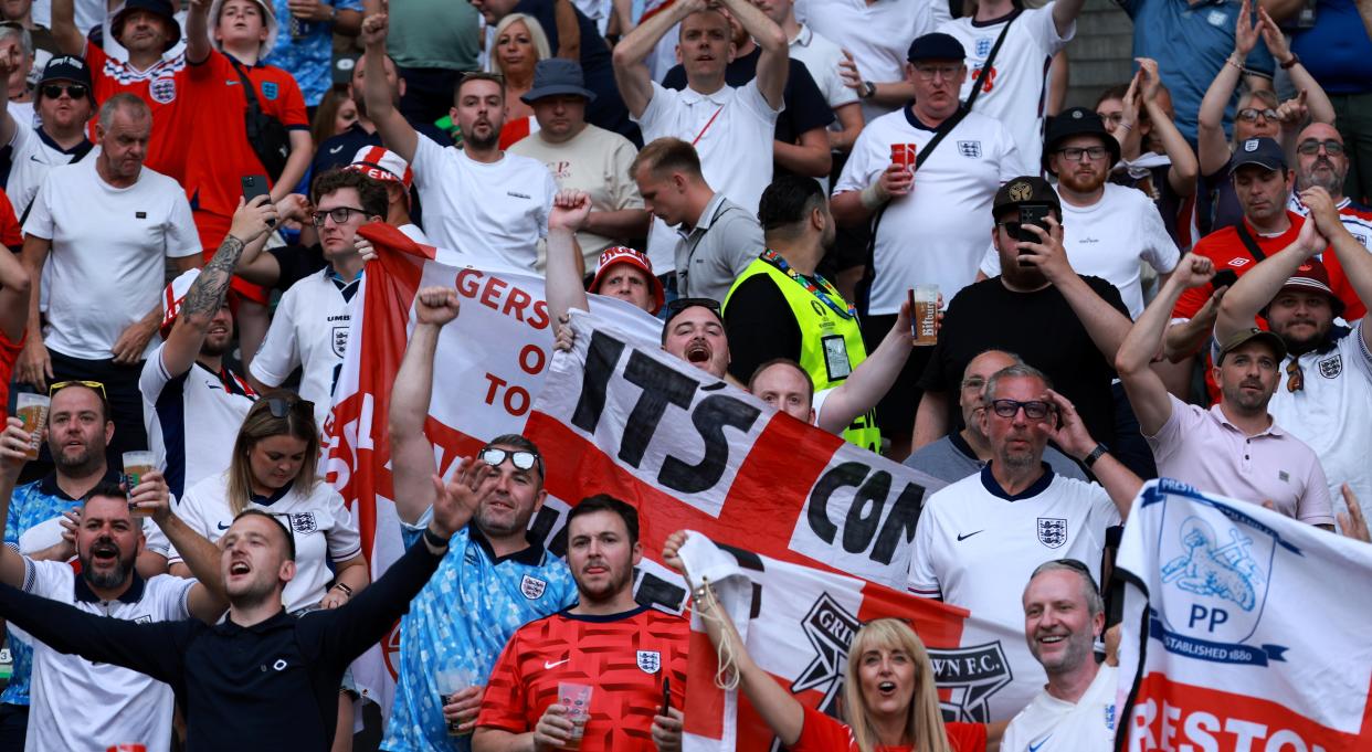 England fans watch on in the stadium (EPA)