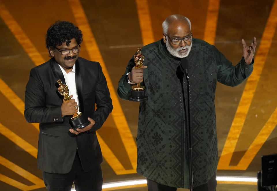 M.M. Keeravaani, right, and Chandrabose accept the award for best original song for "Naatu Naatu" from "RRR" at the Oscars on Sunday, March 12, 2023, at the Dolby Theatre in Los Angeles. (AP Photo/Chris Pizzello)