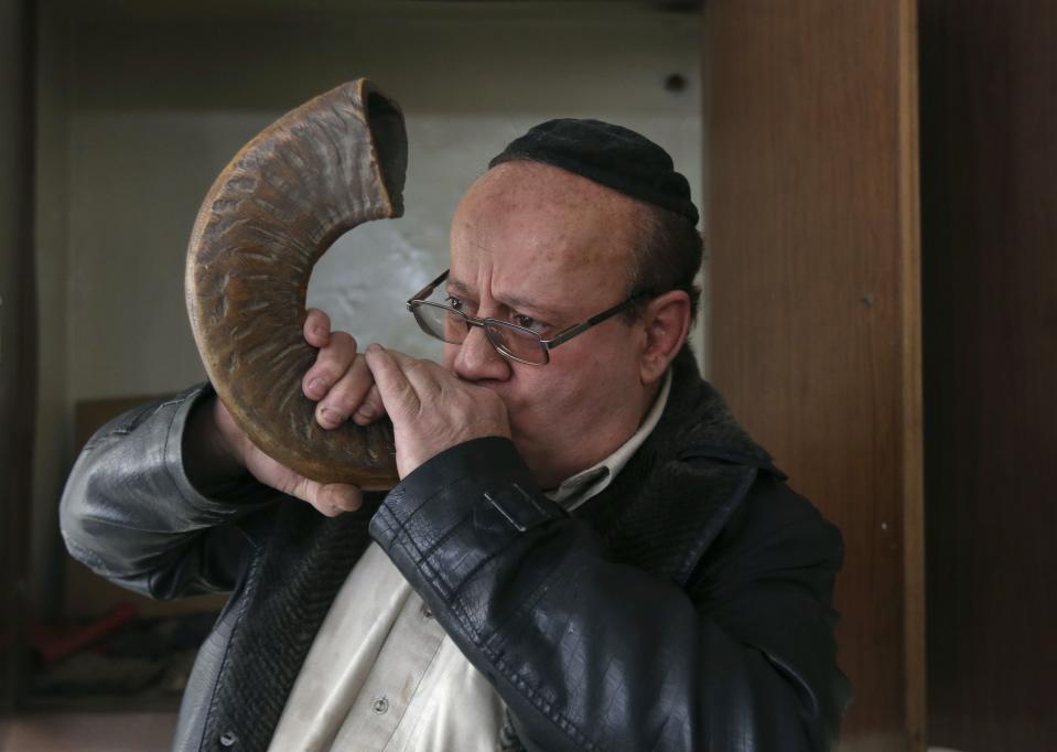 Zabulon Simantov, an Afghan Jew, blows the traditional shofar, or ram's horn, at a synagogue in Kabul