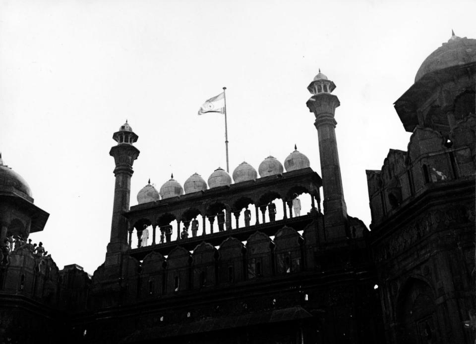 NEW INDIAN FLAG: Indian Mutiny Centenary - India this year celebrates the Centenary of the Indian Mutiny of 1857. The Indians call it the “First war of Independence”. This AP-photo shows the new Indian flag, a horizontal tricolour of saffron, white and green, flying from the minaretted battlements of the historic red fort at Delhi, India on August 16,1947, after being hoisted by Pandit Jawaharlal Nehru,the first prime minister of India. (AP Photo)