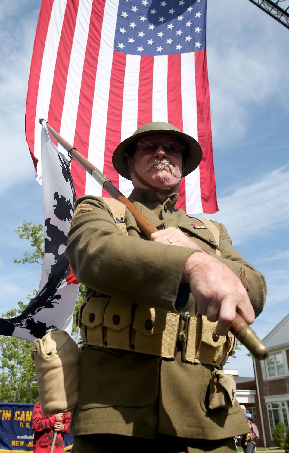 Navy Veteran John Lyman, Toms River, wears a replica Word War I uniform in honor of his grandfather as he marches along Washington Street during the Toms River Memorial Day Parade Monday, May 29, 2023. The parade and ceremony outside Town Hall honors America's war dead and is organized by American Legion Post 129 in the town.