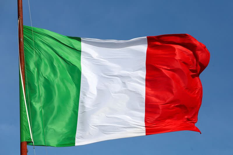FILE PHOTO: The Italian flag waves in front of The "Altare della Patria" also known as "Vittoriano" downtown Rome
