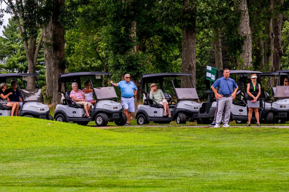 An audience follows the finalists around at the 2021 CCNB Fourball finals.