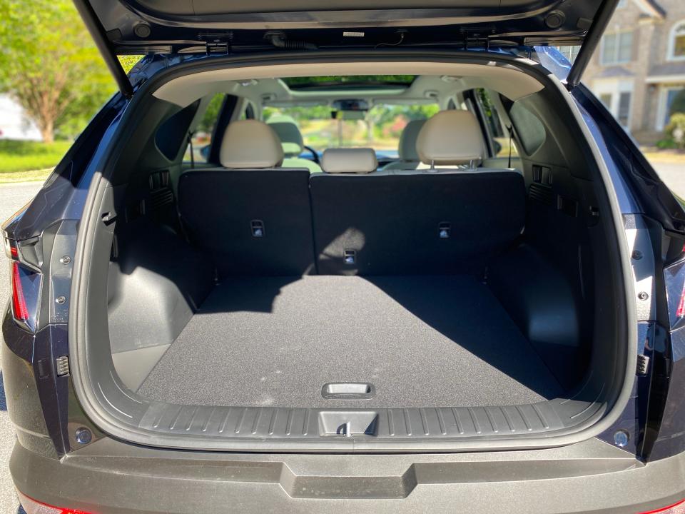 A 2024 Hyundai Tucson Hybrid with its tailgate opened.