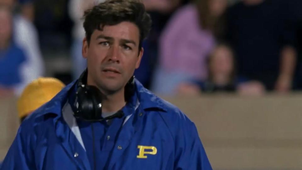 Kyle Chandler looking worried in Friday Night Lights