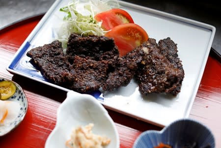 A set menu of pickle-grilled whale meat is prepared at the restaurant P-man in Minamiboso