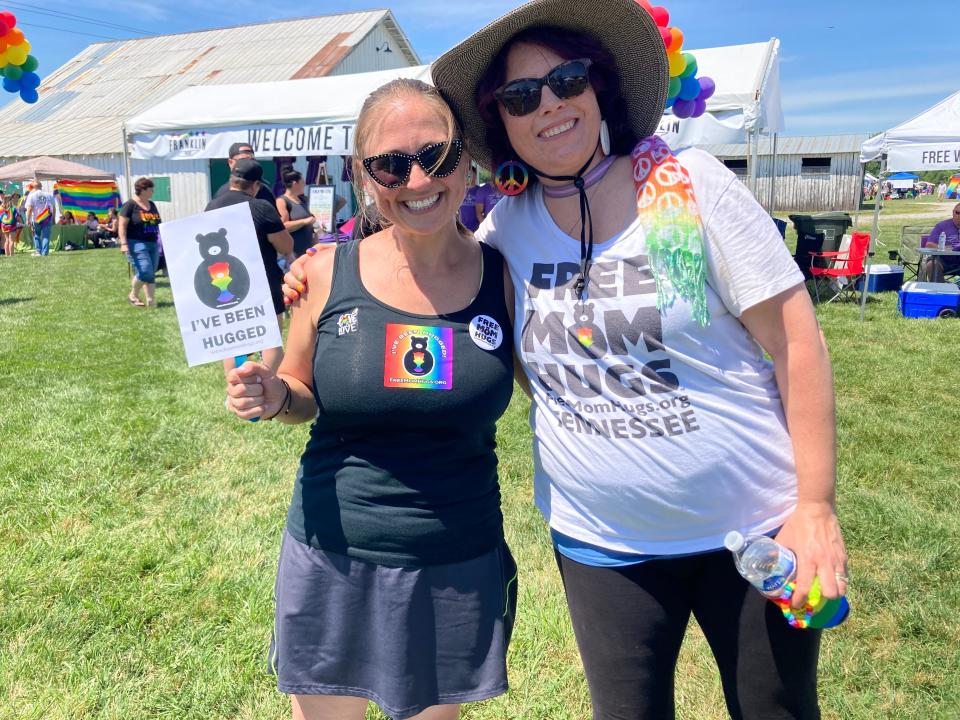 Rachel Bryan and Mary Walton welcome people to Franklin Pride on June 4, 2022.