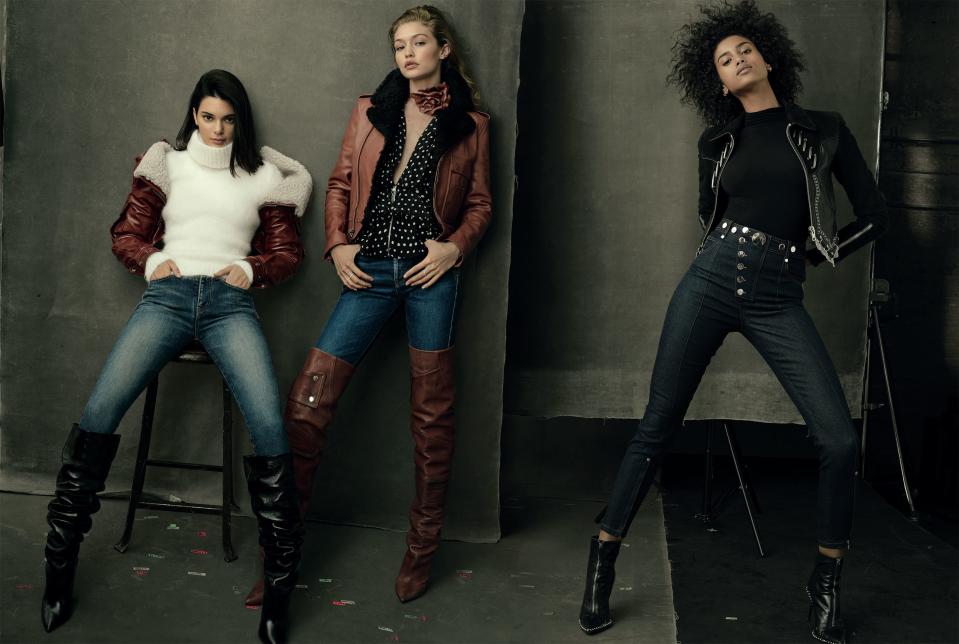 <em>“It’s like going straight to the NBA—you don’t even get a warm-up. Just here you go.” —Kendall Jenner.</em> <em>“I was seventeen [for my first</em> Vogue <em>cover]. It was just fun—and scary and crazy.” —Imaan Hammam.</em> Jenner (far left) wears Saint Laurent by Anthony Vaccarello shearling sleeves, turtleneck ($950), jeans ($650), and boots; Saint Laurent, NYC. Gigi Hadid (center) wears a Saint Laurent by Anthony Vaccarello jacket, blouse ($1,590), jeans ($650), choker, and boots; Saint Laurent, NYC. Messika Paris rings. Hammam wears an Alexander Wang jacket, top, jeans ($495), and boots; alexanderwang.com. Jennifer Meyer earrings.