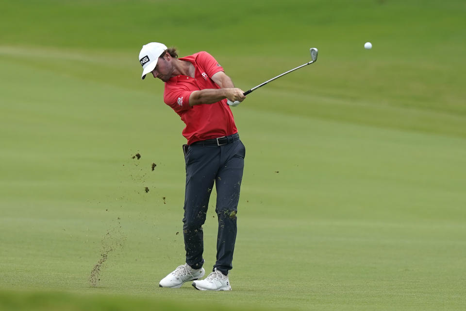 Austin Eckroat hits an approach shot on the 10th hole during the final round of the Byron Nelson golf tournament in McKinney, Texas, Sunday, May 14, 2023. (AP Photo/LM Otero)