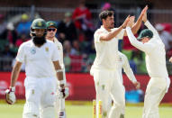 Cricket - South Africa vs Australia - Second Test - St George's Park, Port Elizabeth, South Africa - March 10, 2018. Australia's Mitchell Starc celebrates after dimissing South AfricaÕs Hashim Amla. REUTERS/Mike Hutchings