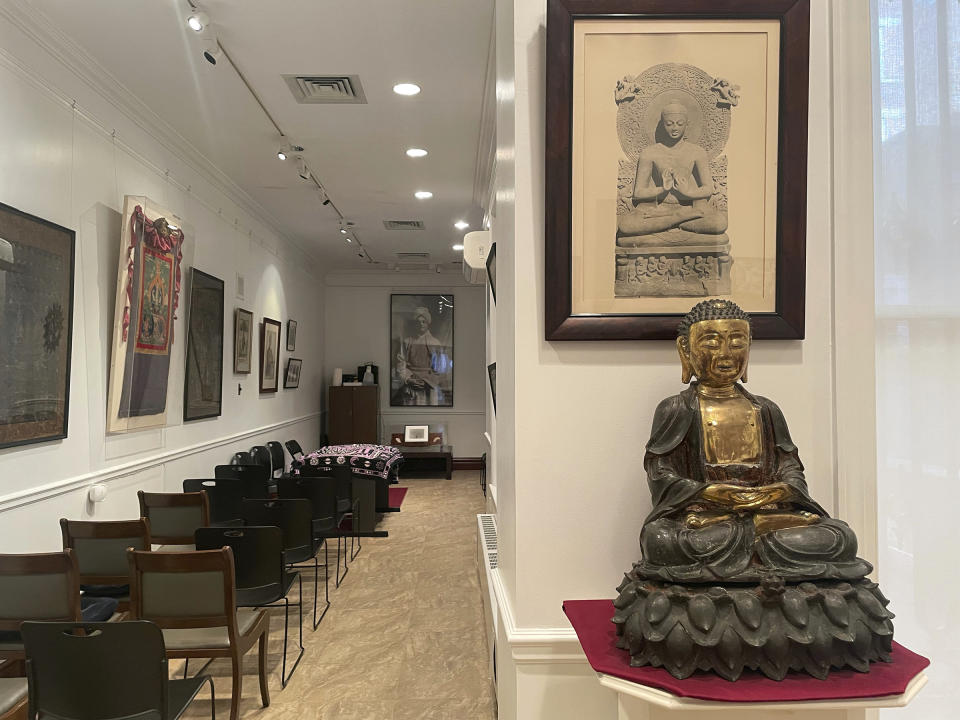 A variety of religious imagery is displayed on the walls of the Ramakrishna-Vivekananda Center of New York, on Sunday, Feb. 4, 2024. (Richa Karmarkar/Religion News Service via AP)