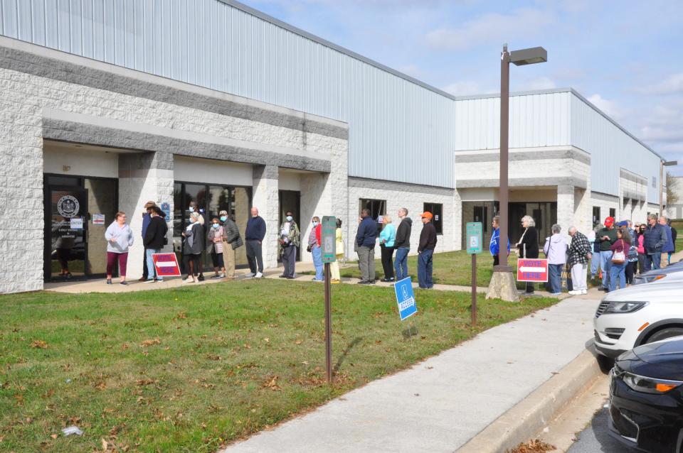 More than 30 people line up outside the Department of Elections Kent County office at 11:25 a.m., 25 minutes after the polls opened for early voting on Oct. 28, 2022.