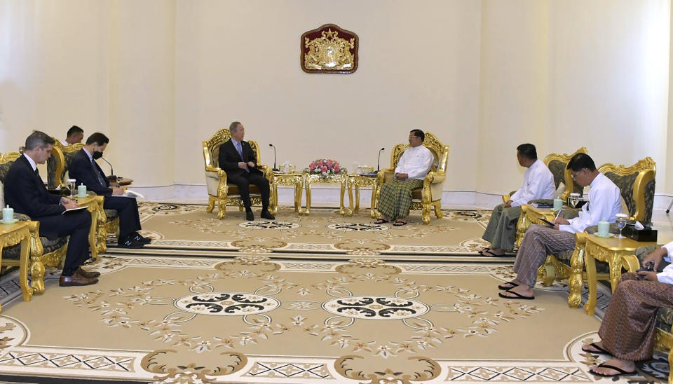 In this photo provided by the Myanmar Military True News Information Team, Senior Gen. Min Aung Hlaing, center right, head of the military council, talks with Ban Ki Moon, center left, former U.N Secretary-General, during their meeting Monday, April 24, 2023, in Naypyitaw, Myanmar. (Military True News Information Team via AP)