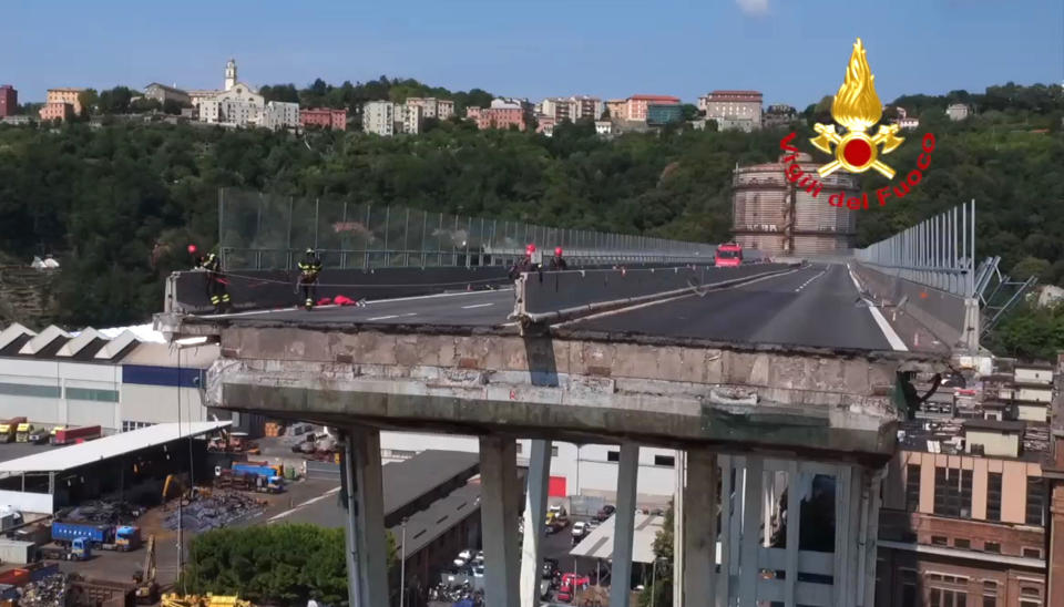 In this frame taken from a video released by the Vigili del Fuoco (Firefighters), an aerial view of the collapsed Morandi highway bridge, in Genoa, Saturday, Aug. 18, 2018. Saturday has been declared a national day of mourning in Italy and includes a state funeral at the industrial port city's fair grounds for those who plunged to their deaths as the 45-meter (150-foot) tall Morandi Bridge gave way Tuesday. (Vigil del Fuoco via AP)