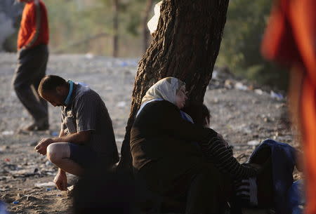 A new group of more than a thousand immigrants wait at the border line of Macedonia and Greece to enter into Macedonia near Gevgelija railway station August 20, 2015. REUTERS/Ognen Teofilovski