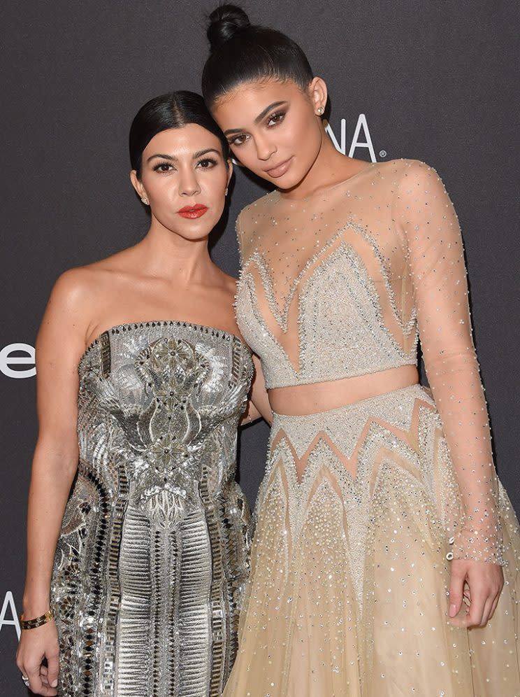 Kourtney Kardashian and Kylie Jenner sparkle at a Golden Globe Awards afterparty. (Photo: Axelle/Bauer-Griffin/FilmMagic)