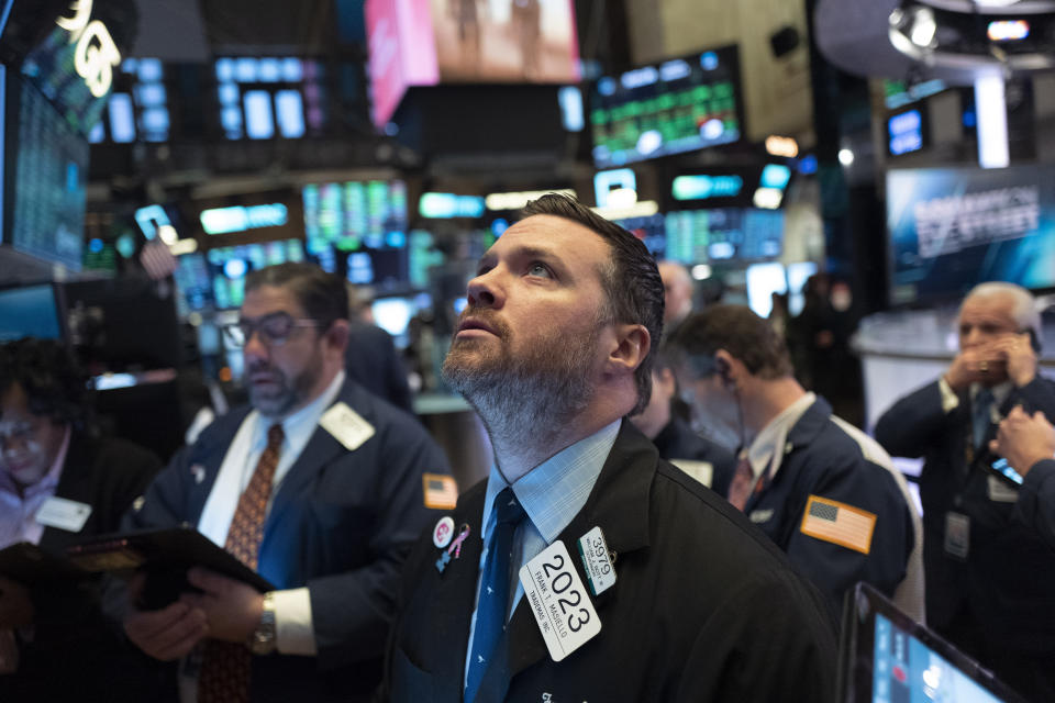 Stock trader Frank Masiello works at the New York Stock Exchange, Tuesday, Feb. 4, 2020. Stocks are opening broadly higher on Wall Street, following gains overseas. (AP Photo/Mark Lennihan)