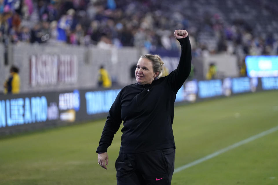 OL Reign head coach Laura Harvey celebrates after the OL Reign defeated the San Diego Wave 1-0 to win an NWSL semifinal playoff soccer match Sunday, Nov. 5, 2023, in San Diego. (AP Photo/Gregory Bull)