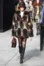 <p>The model rocked a bucket hat and fur coat while walking the outdoor runway at Marc Jacobs.</p>