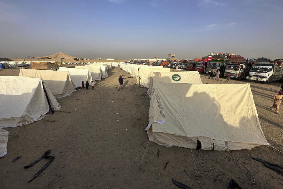 Afghans children play beside their tent as they with others wait for clearance to depart for their homeland at a deportation camp set up by authorities to facilitate illegal immigrants, in Chaman, a town on the Pakistan-Afghanistan border, Wednesday, Nov. 1, 2023. Pakistani security forces on Wednesday rounded up, detained and deported dozens of Afghans who were living in the country illegally, after a government-set deadline for them to leave expired, authorities said. (AP Photo/Habibullah Achakzai)