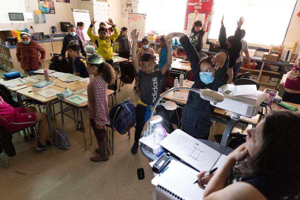 Wendy Gonzalez has her fourth grade class stand up stretch multiple times when they become too rowdy and unfocused during class at Downer Elementary in San Pablo, Calif.