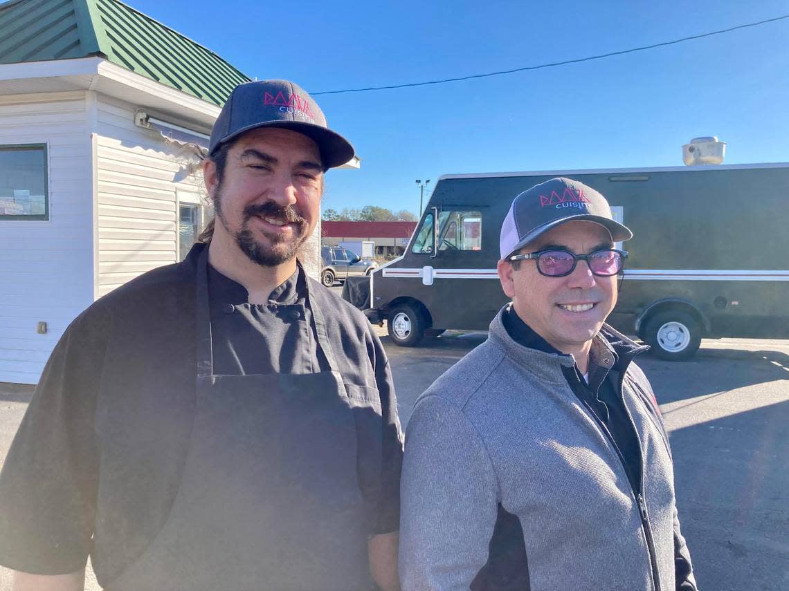 Chefs Scott Kiernan and Jason Delasota outside their new food establishment in Warner Robins. Root 76 Cuisine offers a drive-thru commissary serving breakfast, a food truck serving up international street food for lunch on site and on the go as well as catering services.