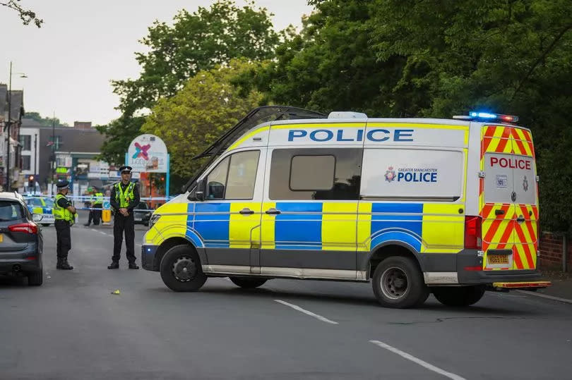 Police responding to the stabbing on Slade Lane