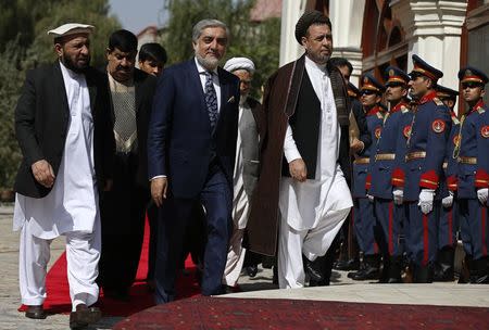 Abdullah Abdullah (C) arrives for inauguration as chief executive in Kabul September 29, 2014. REUTERS/Omar Sobhani