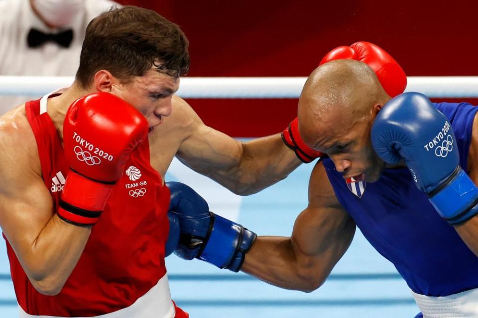 Pat McCormack in red with Roniel Iglesias in blue.