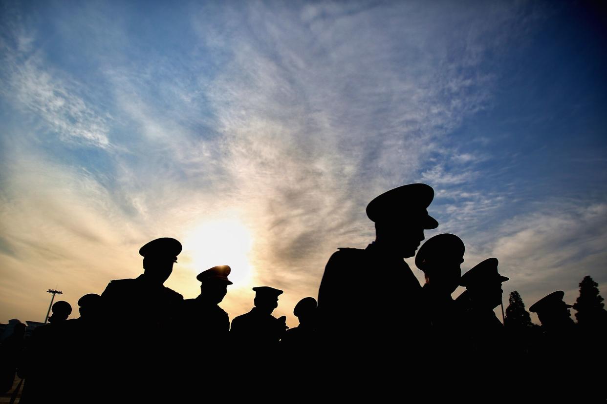 Chinese military delegates arrive at the Great Hall of the People before the third plenary session of China's parliament, the National People's Congress (NPC), on March 12, 2015 in Beijing, China. (Photo by Feng Li/Getty Images)