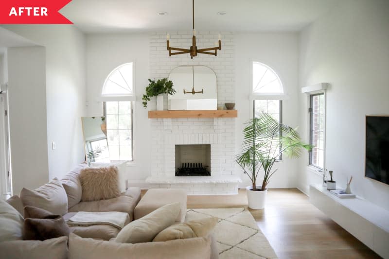 white brick fireplace white walls large sectional