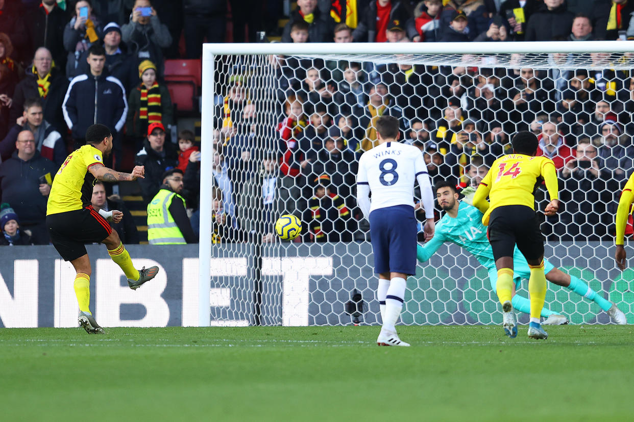 Tottenham goalkeeper Paulo Gazzaniga saves a penalty taken by Watford's Troy Deeney on Saturday. (Photo by Richard Heathcote/Getty Images)