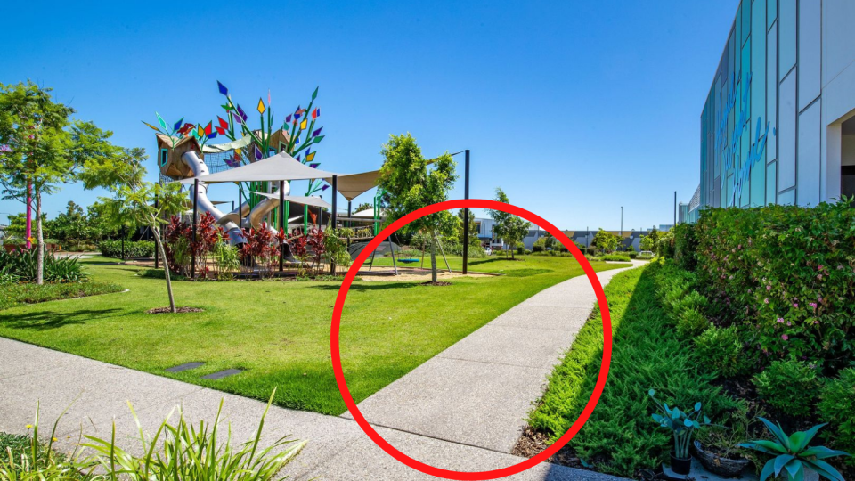 An image of the footpath through the vacant property that is for sale with a red circle around the footpath.