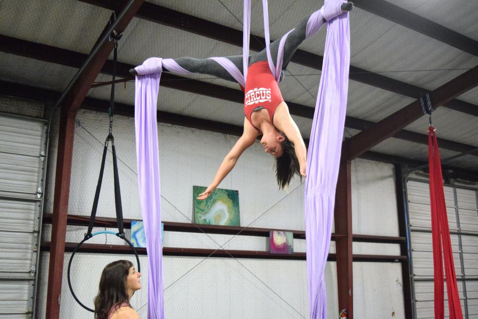 Erin Welch, co-owner and instructor at Sky Craft, practices her aerial skills on silks on Jan. 7, 2022, at their Lafayette gym. Sky Craft will offer aerial silk and circus arts classes for adults and children.