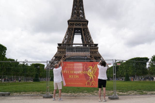Liverpool fans near the Eiffel Tower in Paris ahead of Saturday’s Uefa Champions League final against Real Madrid at the Stade de France