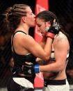 <p>Miesha Tate of the United States (left) embraces Raquel Pennington of the United States after her unanimous decision defeat in their women’s bantamweight bout during the UFC 205 event at Madison Square Garden on November 12, 2016 in New York City. (Photo by Jeff Bottari/Zuffa LLC/Zuffa LLC via Getty Images) </p>