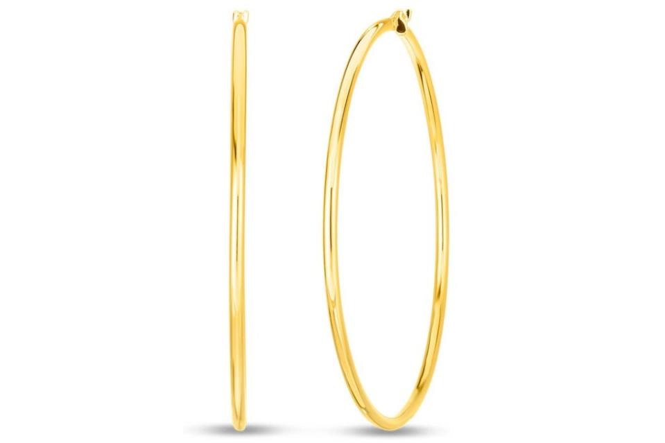 Roberto Coin <a href="https://www.londonjewelers.com/roberto-coin-perfect-gold-hoops-18k-yellow-gold-large-round-hoop-earrings" rel="nofollow noopener" target="_blank" data-ylk="slk:hoops in 18-k yellow gold;elm:context_link;itc:0;sec:content-canvas" class="link ">hoops in 18-k yellow gold</a>, $900 at London Jewelers